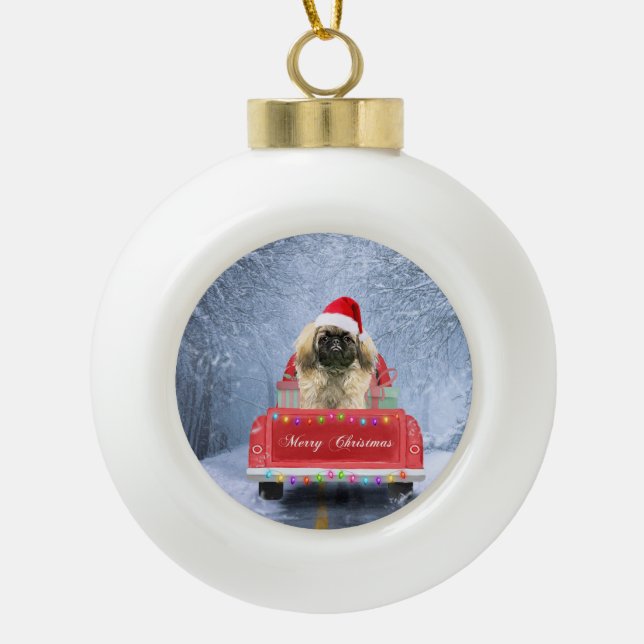 Pekingese Dog in Snow sitting in Christmas Truck  Ceramic Ball Christmas Ornament (Front)