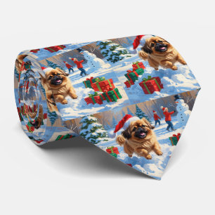 Pekingese Dog Running in Snow with Christmas Hat Tie