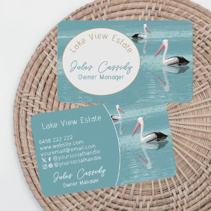 Pelican Couple Paddling on Calm Aqua Water Oval Business Card