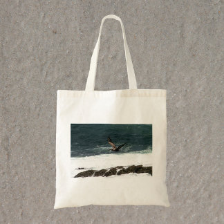 Pelican Flying Over Pacific Ocean Photo Tote Bag