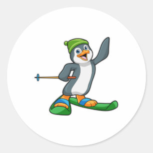 Penguin as Skier with Ski & Cap Classic Round Sticker