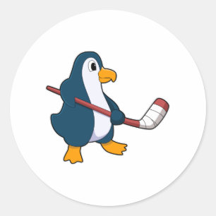Penguin at Ice hockey with Ice hockey stick Classic Round Sticker