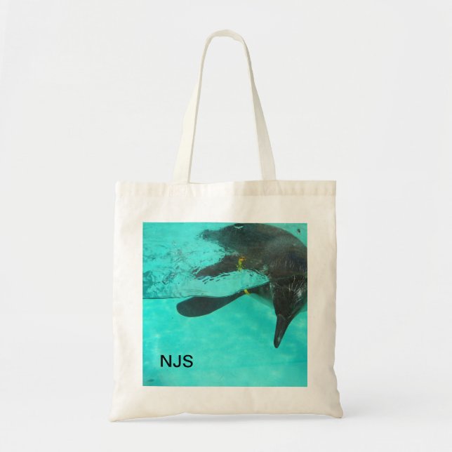 Penguin Dives into blue water Tote Bag (Front)