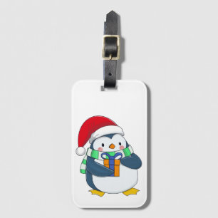 Penguin in a Christmas hat with a gift Luggage Tag