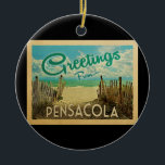 Pensacola Beach Vintage Travel Ceramic Tree Decoration<br><div class="desc">This Greetings From Pensacola vintage postcard design features a sandy beach with a beautiful turquoise ocean water and above the sea,  a blue sky with billowy white clouds. In vintage travels style.</div>