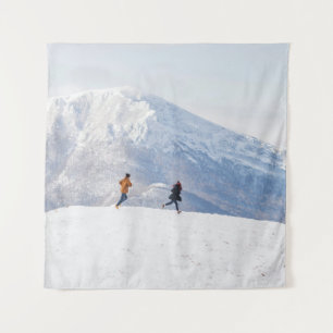 People having fun and running in mountains on the tapestry