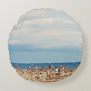 People on brown sand beach round cushion