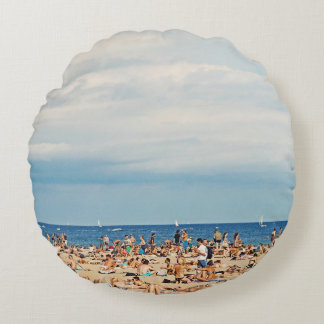 People on brown sand beach round cushion