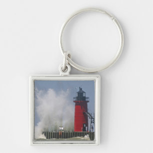 People on jetty watch large breaking waves in 2 key ring