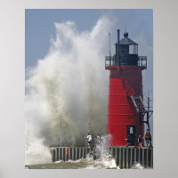 People on jetty watch large breaking waves in