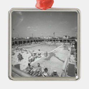 People relaxing at outdoor swimming pool B&W Metal Tree Decoration