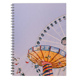 People riding on yoyo ride at daytime notebook