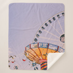 People riding on yoyo ride at daytime sherpa blanket