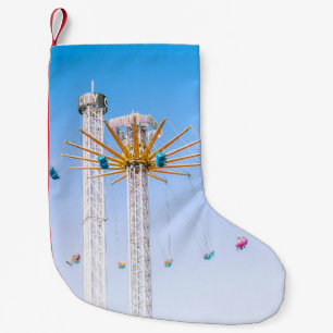 People riding swing amusement ride low-angle photo small christmas stocking