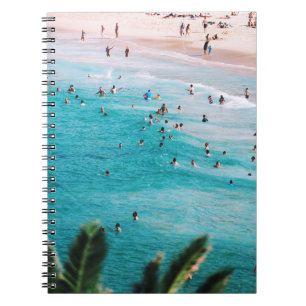 People swimming in the beach notebook