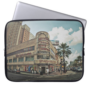 PEOPLE WALKING NEAR BUILDINGS DURING DAYTIME LAPTOP SLEEVE
