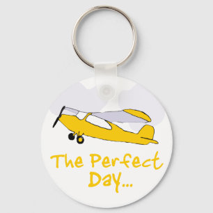 Perfect day flying aeroplane key ring