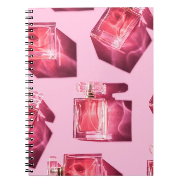 Perfume bottles, pink background, flatlay notebook (Front)