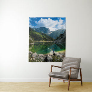 Person at mountain lake tapestry