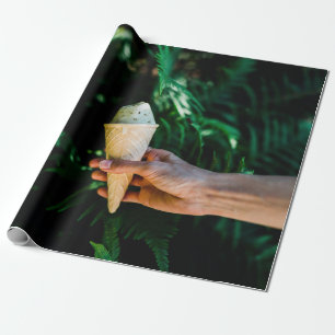 Person holding ice cream wrapping paper