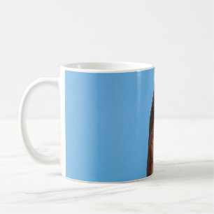 Person holding lemon coffee mug