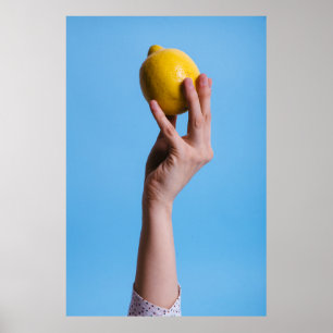 Person holding lemon poster