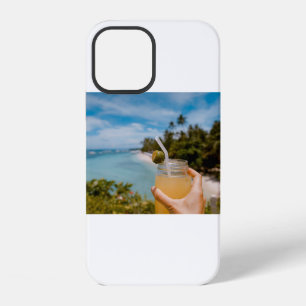 Person holding mason jar with filled with juice at iPhone 12 case