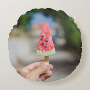 Person holding popsicle in the morning round cushion