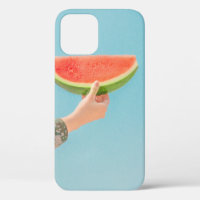 Person holding sliced watermelon