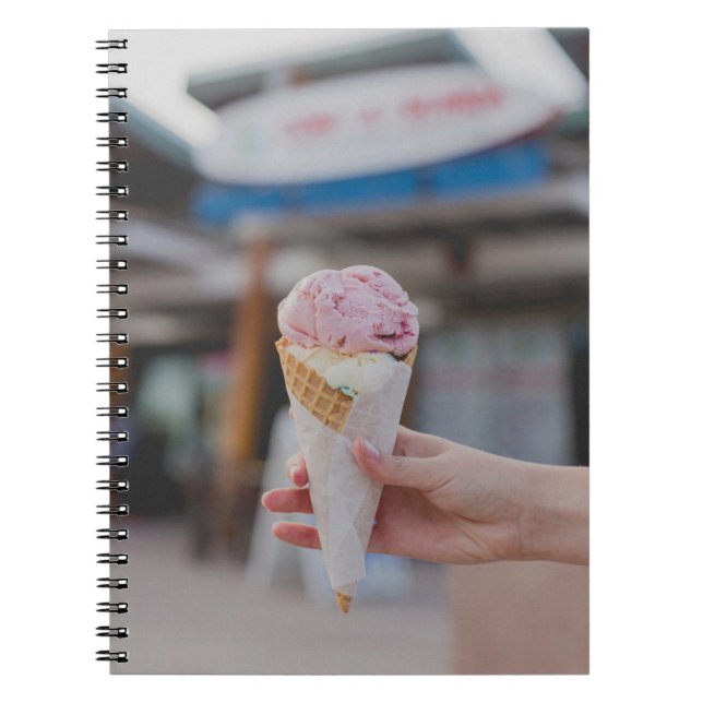 Person holding strawberry ice cream notebook (Front)