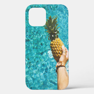 Person holding yellow pineapple iPhone 12 case
