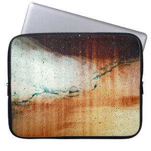 Person in black flip flops standing on brown sand laptop sleeve