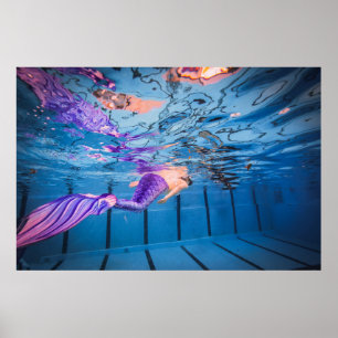 Person in purple pants lying on blue hammock poster