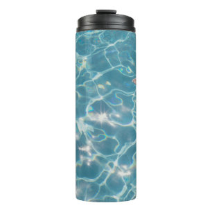 Person on swimming pool thermal tumbler