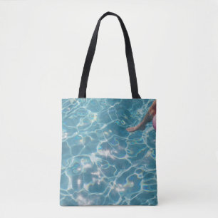 Person on swimming pool tote bag