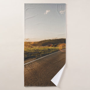 Person running in road in the morning bath towel