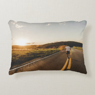 Person running in road in the morning decorative cushion