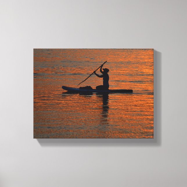 Person silhoutte kayaking at river canvas print (Front)