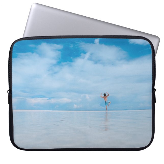 Person standing in body of water laptop sleeve (Front)