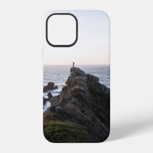 PERSON STANDING ON ROCK CLIFF NEAR BODY OF WATER iPhone 12 CASE
