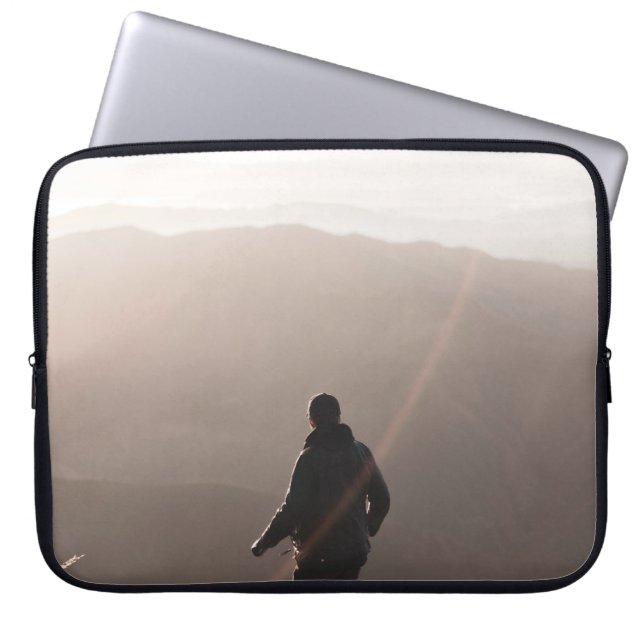 Person standing on rock laptop sleeve (Front)