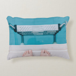 Person standing on swimming pool ladder decorative cushion