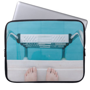 Person standing on swimming pool ladder laptop sleeve