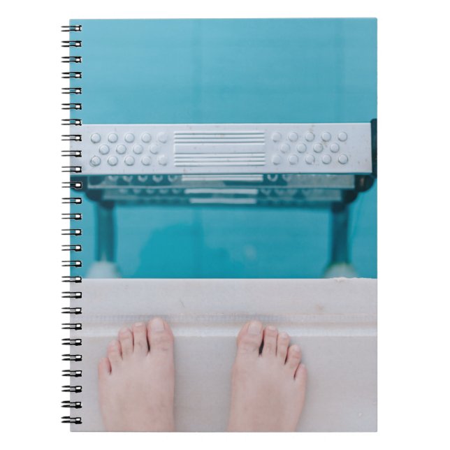 Person standing on swimming pool ladder notebook (Front)