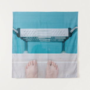 Person standing on swimming pool ladder tapestry