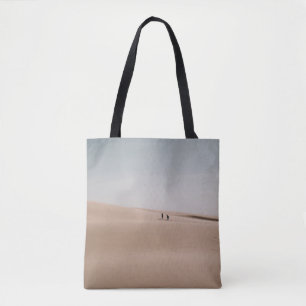 PERSON WALKING ON BROWN SAND DURING DAYTIME TOTE BAG