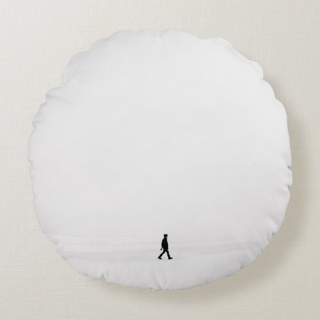 PERSON WALKING ON SNOWFIELD ROUND CUSHION (Front)