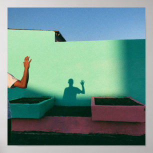 Person waving reflecting shadow on teal wall paint poster