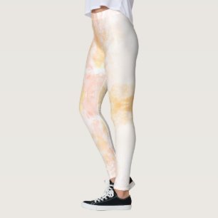 Person wearing leggings with a soft, pastel
