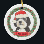 Personalised Bernedoodle Red and Green Santa Hat Ceramic Tree Decoration<br><div class="desc">I am in love with this beautifully detailed watercolor illustration of a grey, black, and white bernedoodle or sheepadoodle on an ornament in a sweet santa hat! Personalise these pastel ornaments and make the nice list this year! For the perfect presents, pair it with a matching item from the collection...</div>